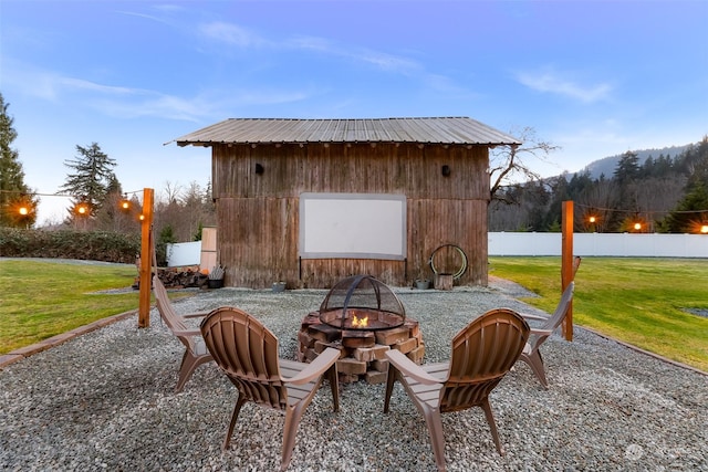 view of patio / terrace featuring an outdoor fire pit