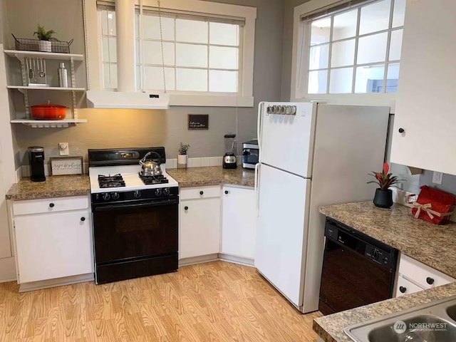 kitchen with light hardwood / wood-style flooring, dishwasher, range with gas stovetop, white cabinets, and white fridge