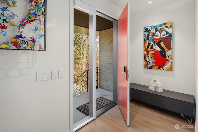 doorway with light hardwood / wood-style flooring