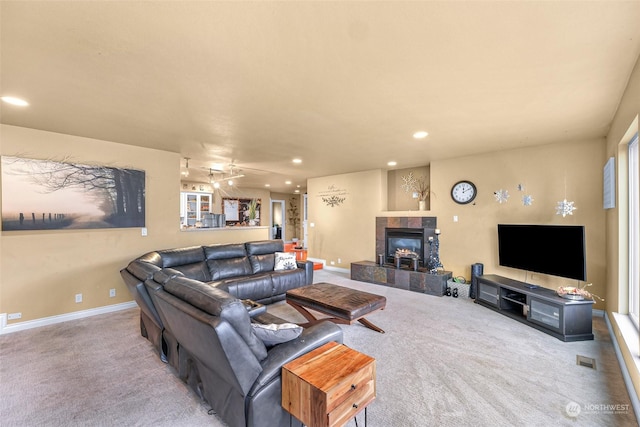 living room featuring carpet flooring and a fireplace