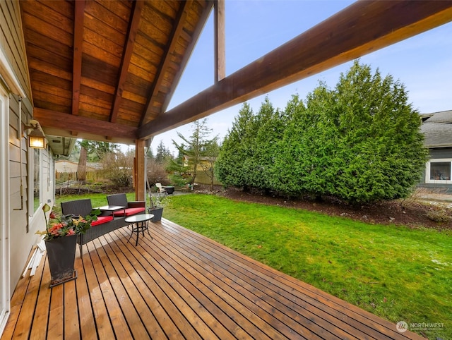 wooden deck with a yard