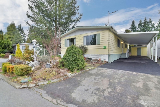 view of property exterior with a carport