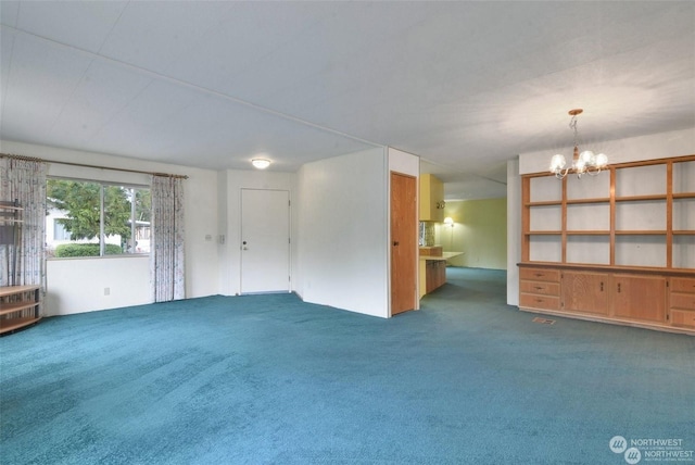 unfurnished living room featuring a notable chandelier, carpet floors, and radiator