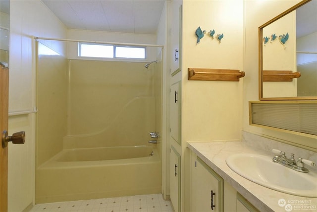 bathroom with vanity and washtub / shower combination