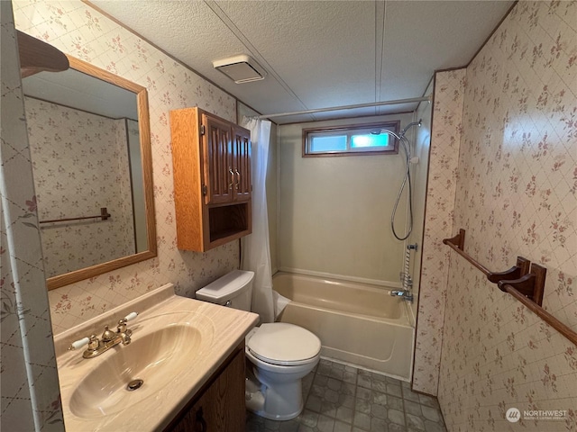 full bathroom with vanity,  shower combination, toilet, and a textured ceiling