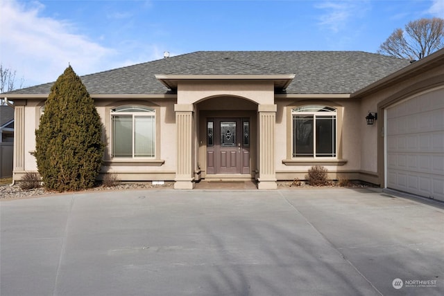 view of front of property with a garage