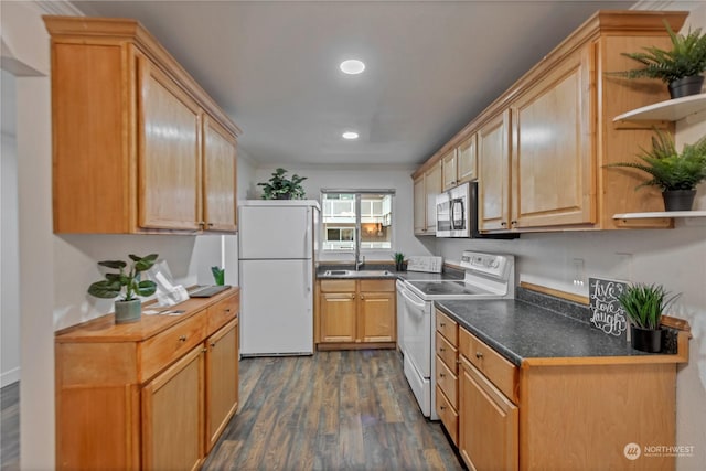 kitchen featuring light brown cabinetry, white appliances, and dark hardwood / wood-style floors