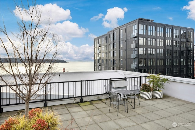 view of patio featuring a water view