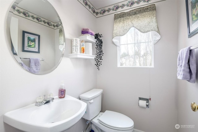 bathroom with sink and toilet