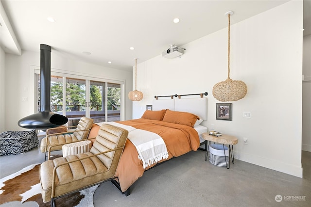 bedroom with concrete flooring, baseboards, access to exterior, and recessed lighting