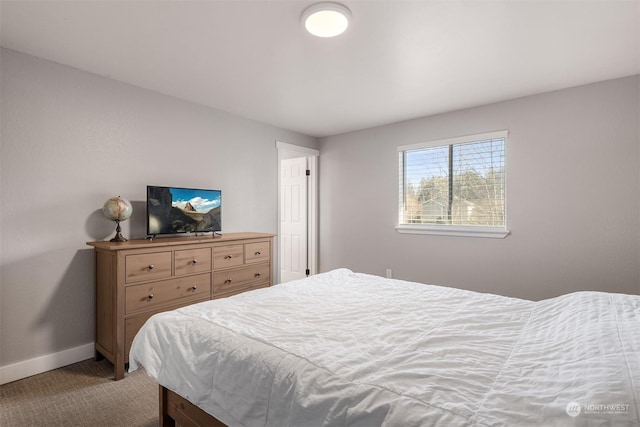 bedroom with light colored carpet