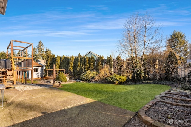 view of yard with a playground and a patio area