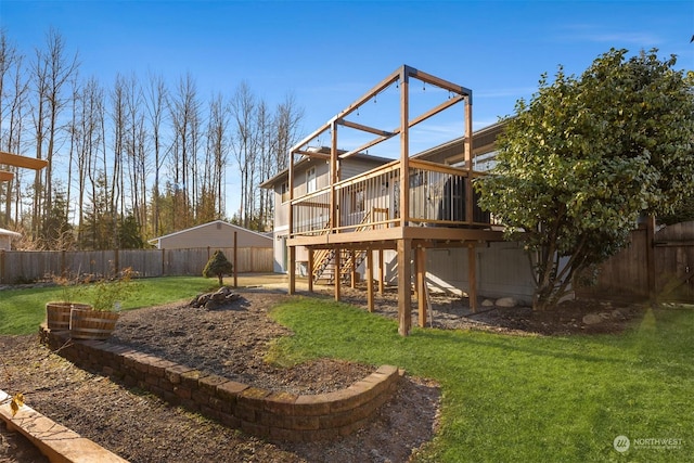 rear view of property featuring a yard and a deck