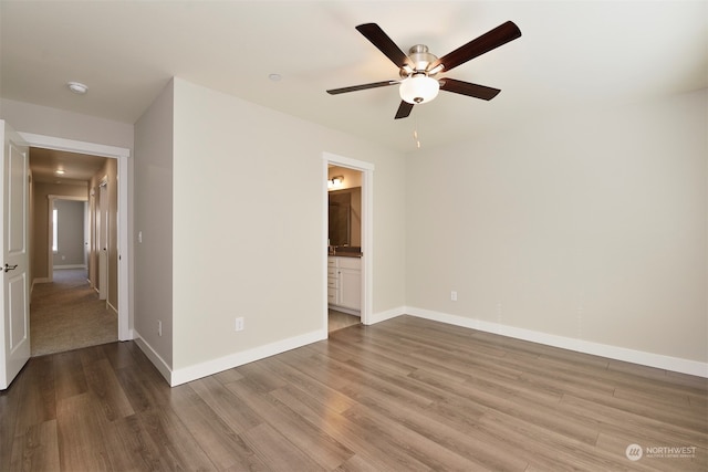 unfurnished room with ceiling fan and hardwood / wood-style floors