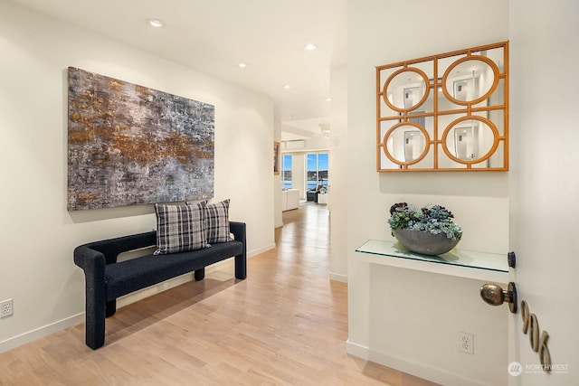 hall with light hardwood / wood-style flooring