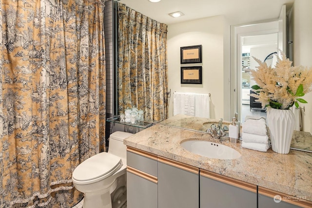 bathroom with vanity and toilet