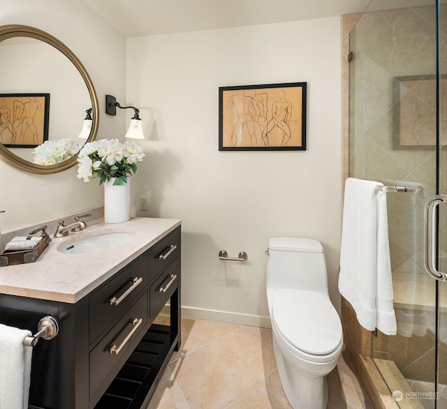 bathroom with tile patterned flooring, vanity, an enclosed shower, and toilet