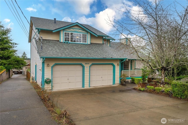 exterior space with driveway, a shingled roof, and a garage