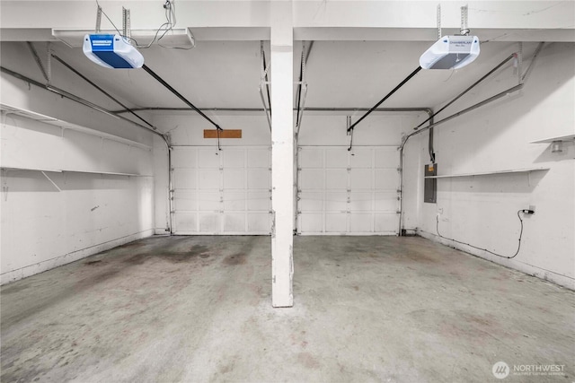 parking garage with electric panel and a garage door opener