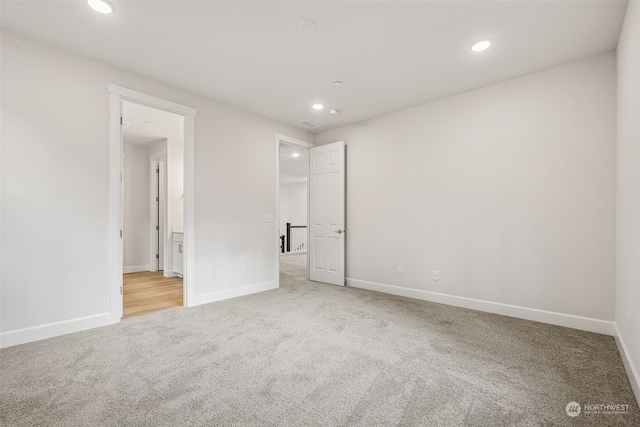 unfurnished room featuring carpet