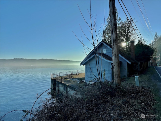 dock area with a water and mountain view