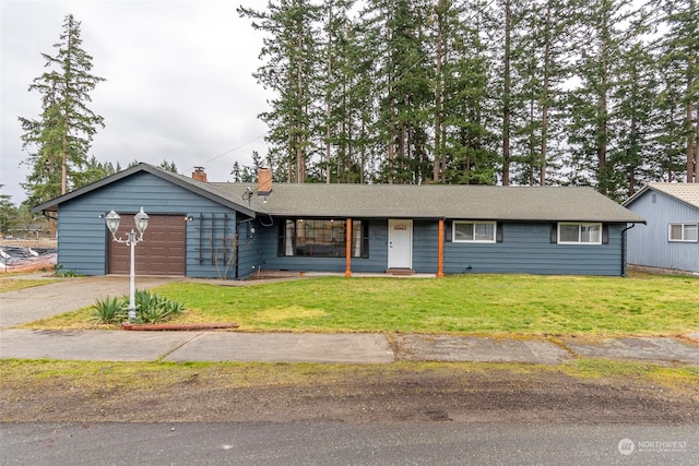 ranch-style house featuring a garage and a front yard