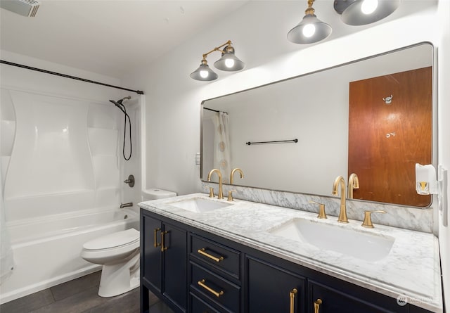 full bathroom featuring vanity, tub / shower combination, and toilet