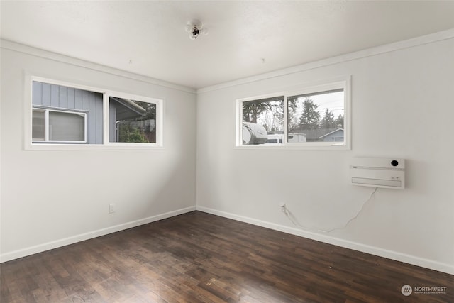 spare room featuring dark hardwood / wood-style flooring