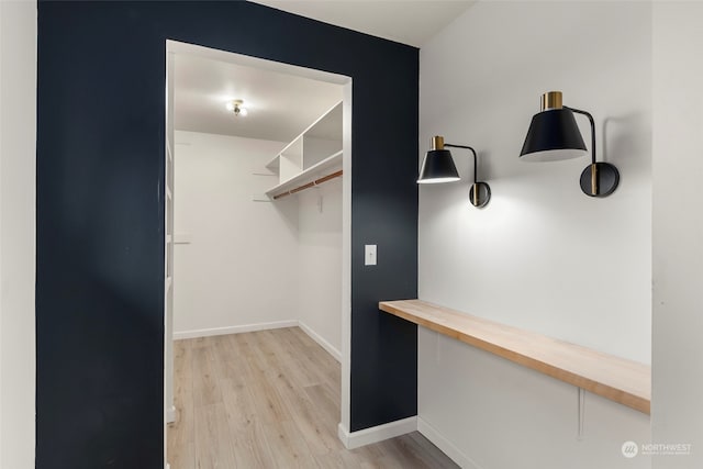 spacious closet with light wood-type flooring