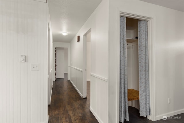 hall with dark hardwood / wood-style floors