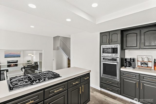 kitchen featuring recessed lighting, appliances with stainless steel finishes, light countertops, and light wood-style floors