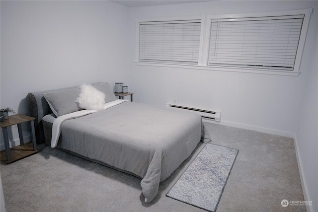 bedroom featuring a baseboard radiator and light colored carpet