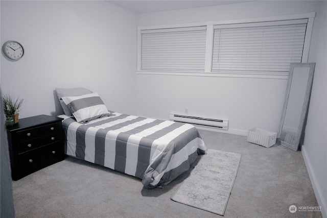 carpeted bedroom with a baseboard radiator