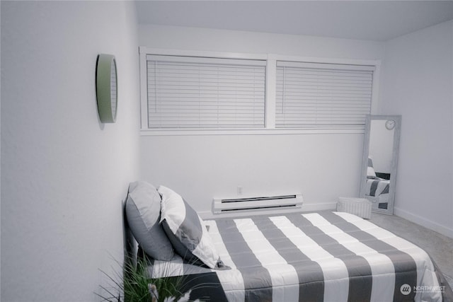 bedroom featuring a baseboard radiator and carpet