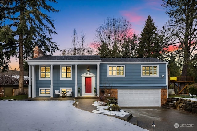 raised ranch featuring a garage