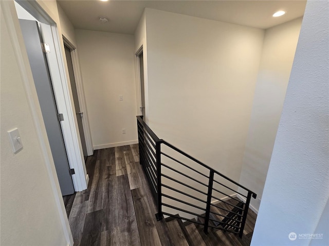 hallway with dark hardwood / wood-style floors