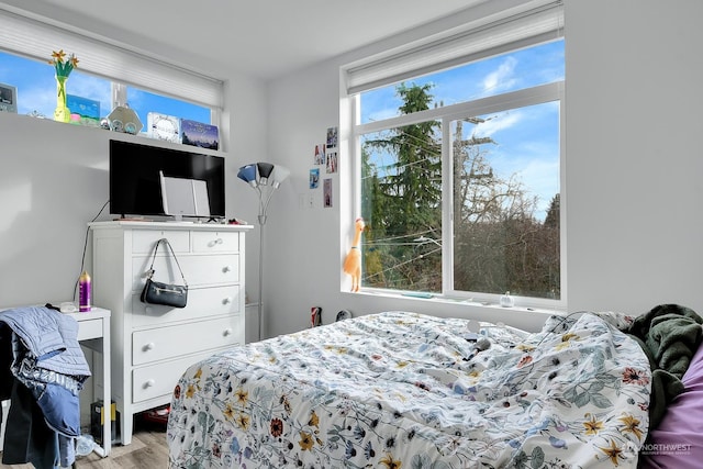 bedroom with light hardwood / wood-style floors