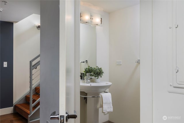 bathroom with hardwood / wood-style flooring and sink