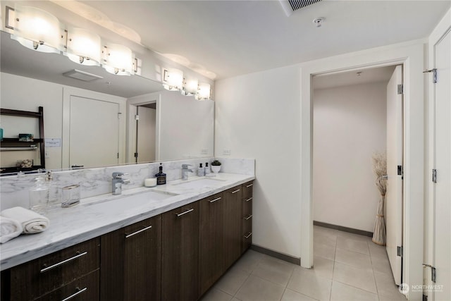 bathroom with tile patterned flooring and vanity