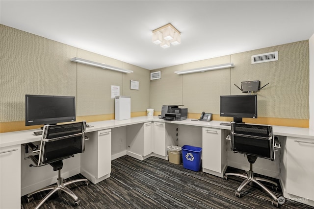 office area featuring dark hardwood / wood-style floors and built in desk