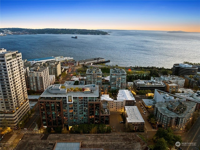 aerial view at dusk with a water view