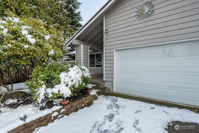 view of snow covered garage