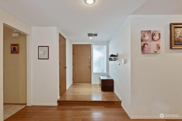 hallway featuring hardwood / wood-style floors