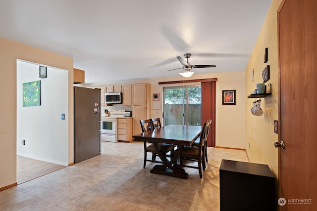 dining space featuring ceiling fan