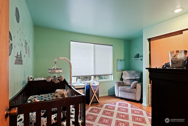 bedroom with wood-type flooring