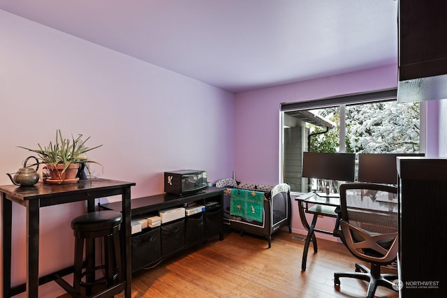 home office with light wood-type flooring