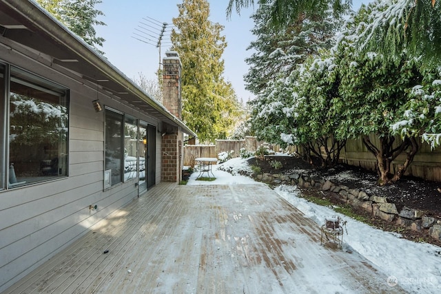 view of snow covered deck