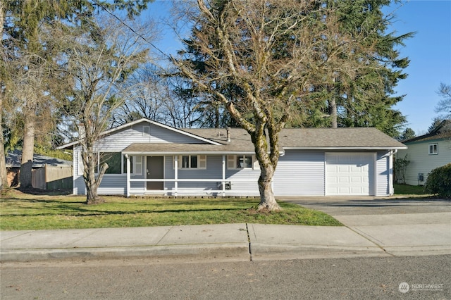 single story home featuring a garage and a front yard