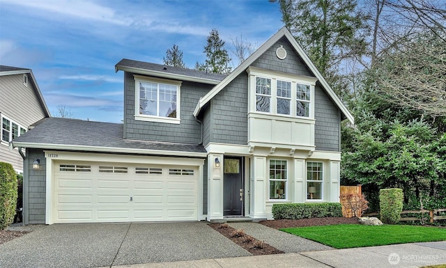 view of front of home featuring concrete driveway