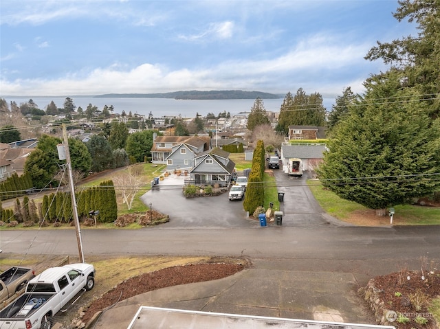 birds eye view of property featuring a water view